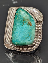 Load image into Gallery viewer, A sterling silver ring with a light blue turquoise stone, featuring a decorative hand stamped band.